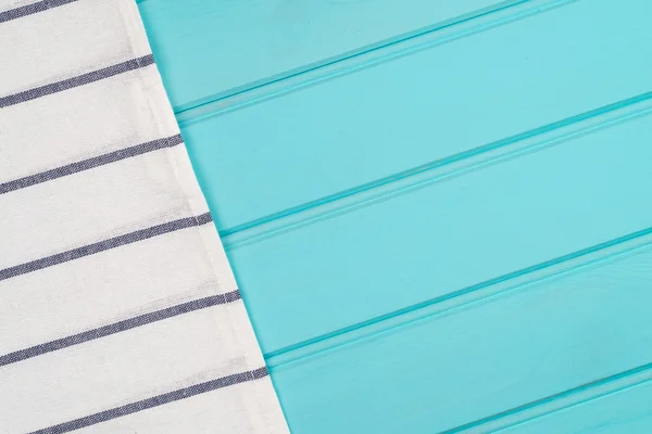 Blue and white towel over table — Stock Photo, Image