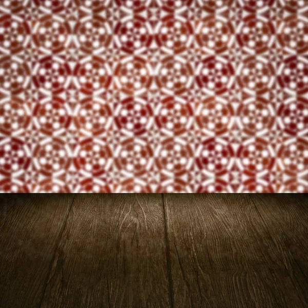 Wood table top and blur vintage ceramic tile pattern wall — Stock Photo, Image