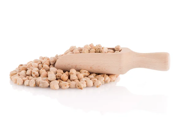 Uncooked chickpeas and wooden scoop — Stock Photo, Image