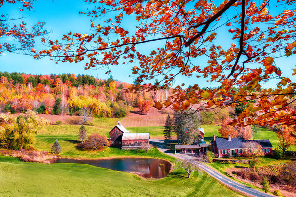 Idyllic New England rural farm and landscape with colorful autumn foliage. 