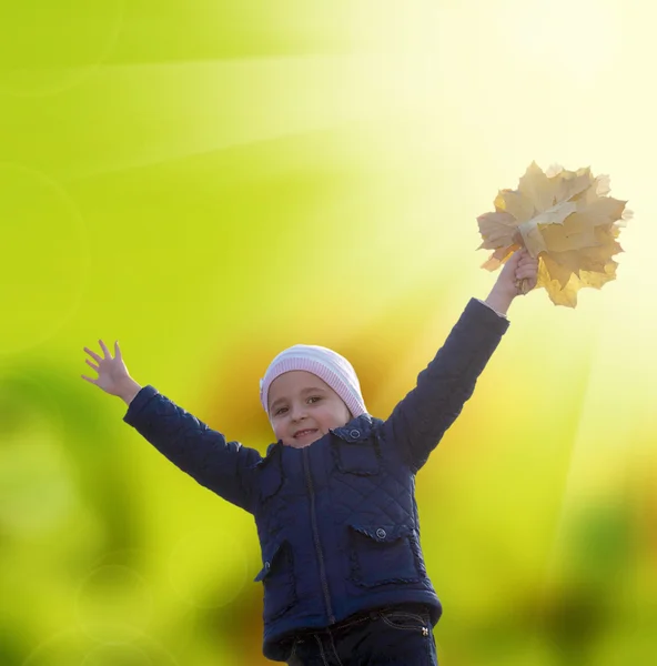 Happy Little Girl with bouquet autumn yellow dry leaves — Stock Photo, Image