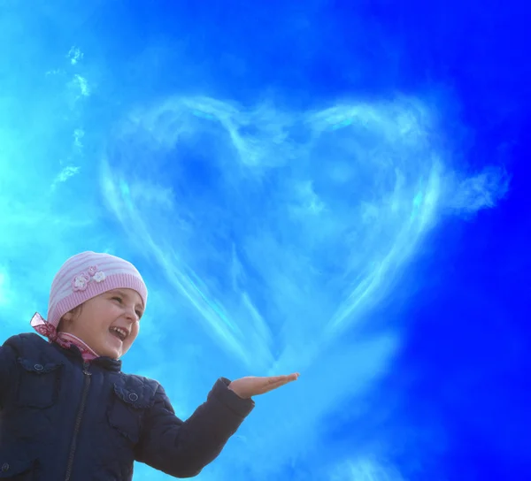 Happiness Child.Happy little girl and clouds heart — Stock Photo, Image