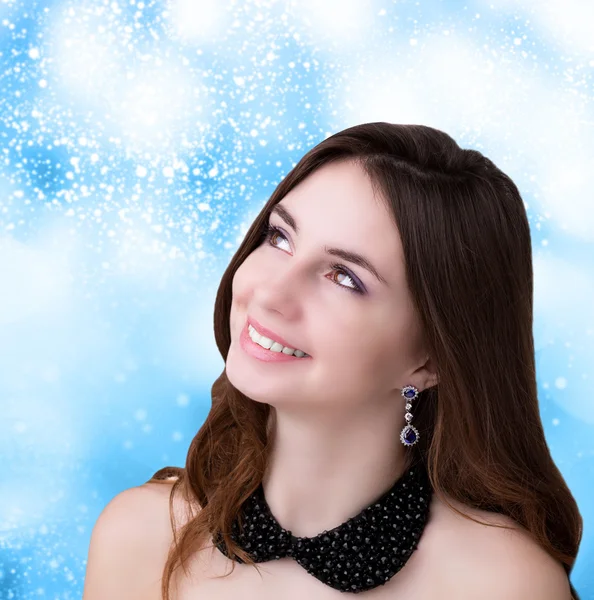 Beautiful Young Woman over snow Christmas background — Stock Photo, Image