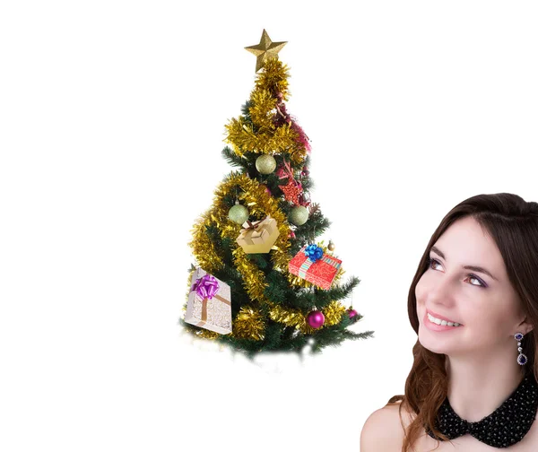 Beautiful Caucasian Women with green  Christmas Eve tree over white background.New Year Royalty Free Stock Photos