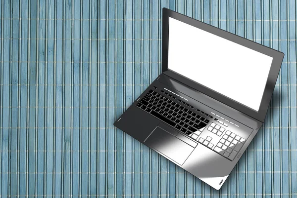 Yeni modern dizüstü closeup ahşap mavi ışık arka plan üzerinde