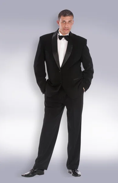 Caucasian adult man in classic tuxedo — Stock Photo, Image