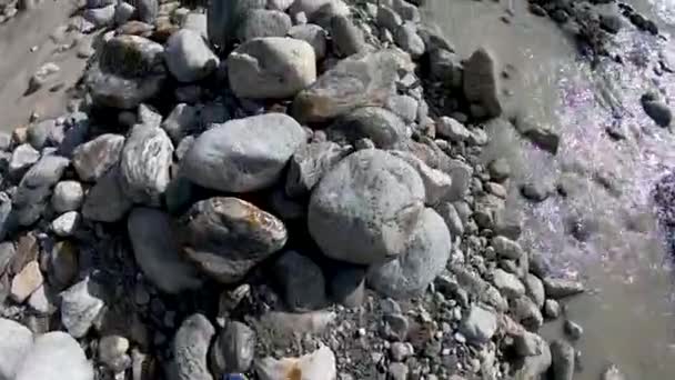 Men walking mountain river and stones Stock Video