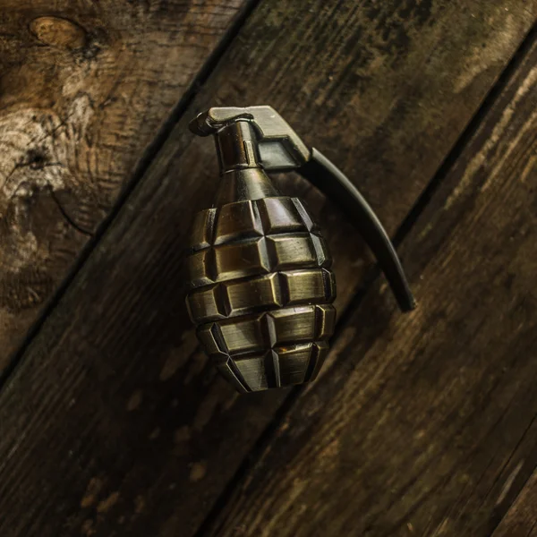 Hand grenade on wood — Stock Photo, Image
