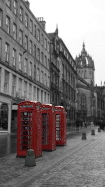 Three British Phone Booths on Royal Mile street in Edinburgh, Scotland clipart