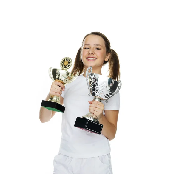Proud young girl holding two trophies — Stock Photo, Image