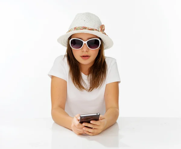 Beautiful little girl in a hat and sunglasses — Stock Photo, Image