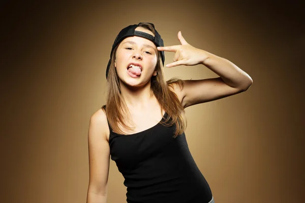 Young Girl in Cap and Sleeveless Funky Pose — Stock Photo, Image