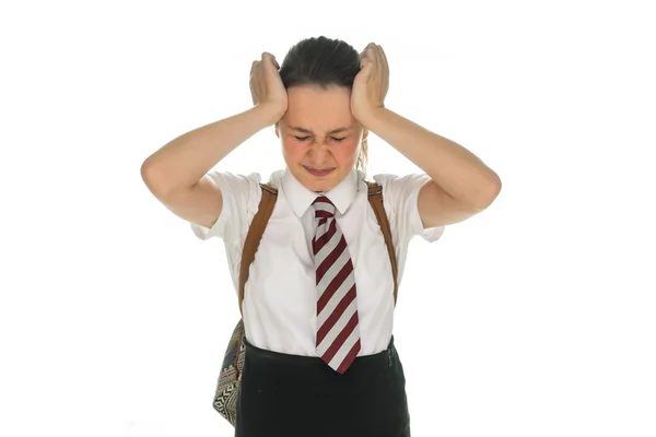 Jonge schoolgirl met een hoofdpijn of migraine — Stockfoto