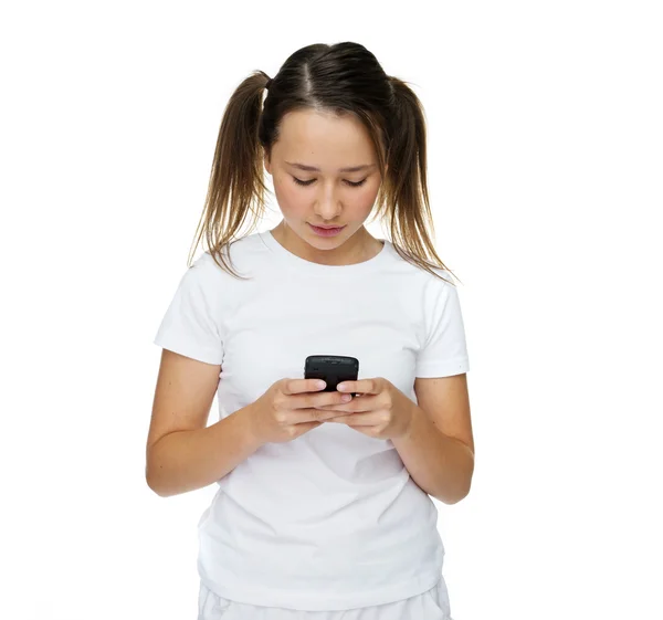 Little girl texting on her mobile phone — Stock Photo, Image