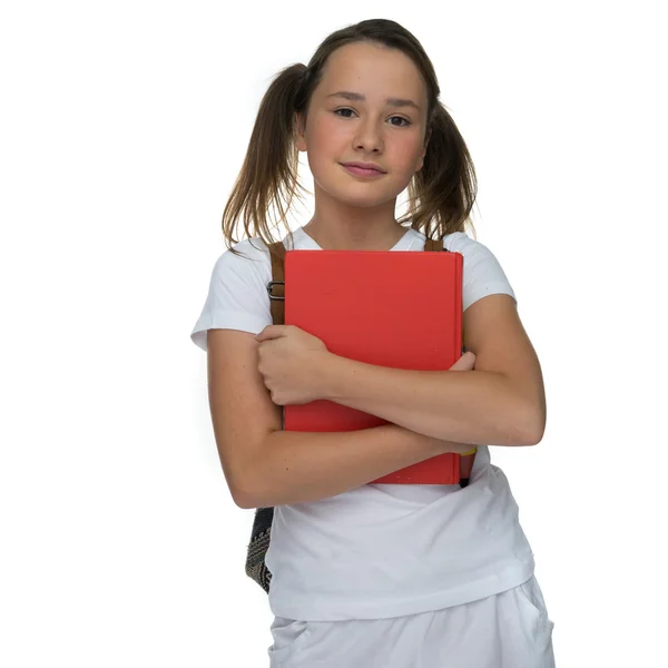 Joven colegiala agarrando un libro de texto — Foto de Stock