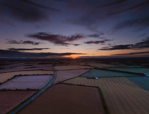 Colorful sunrise over agricultural land — Stock Photo, Image