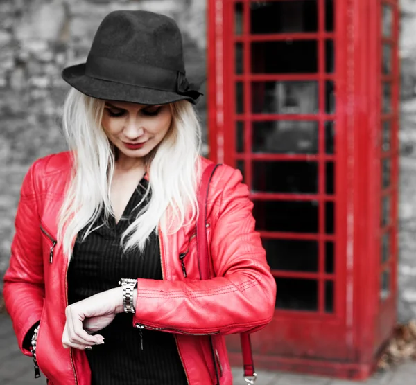 Impatient young woman checking her watch — Stock Photo, Image