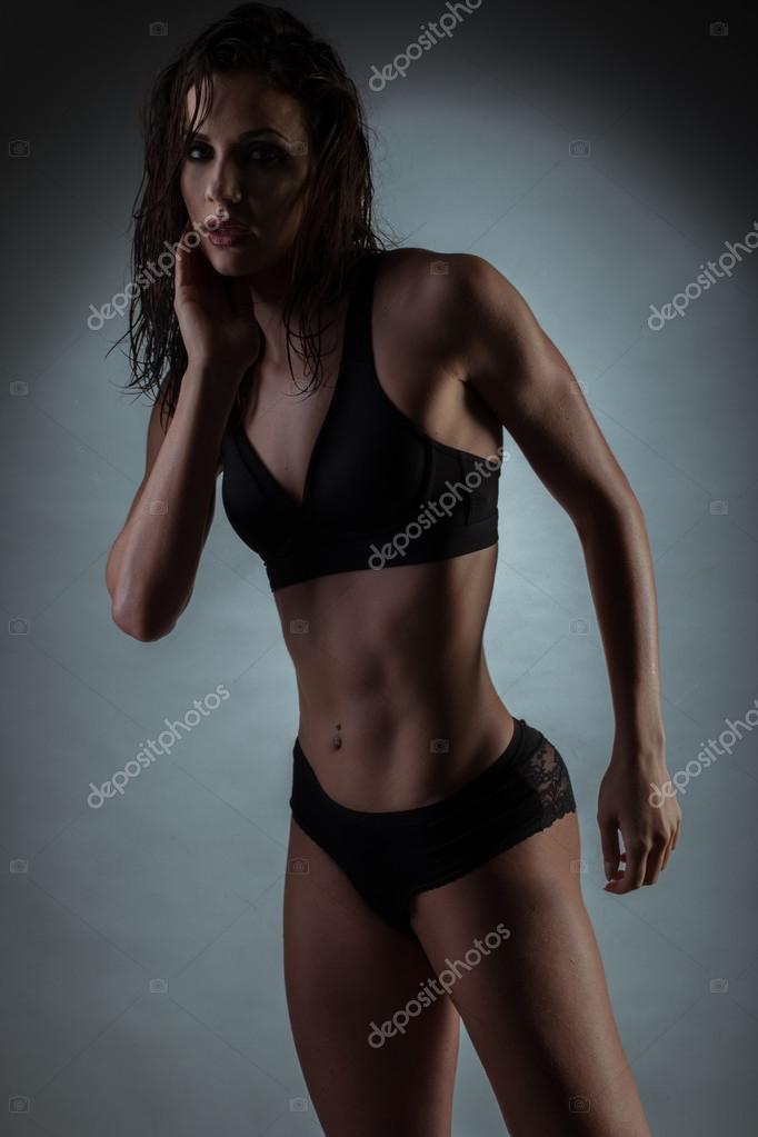 Seductive Gym Fit Woman Wearing Black Underwear Stock Photo by