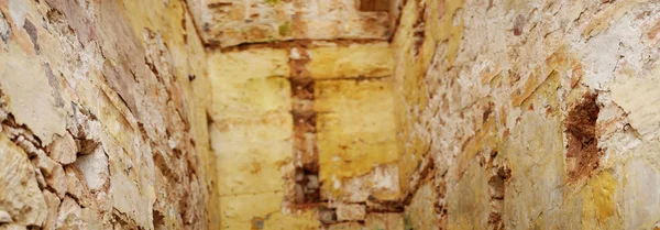 Interior of a ruined fortress with stone walls — Stock Photo, Image