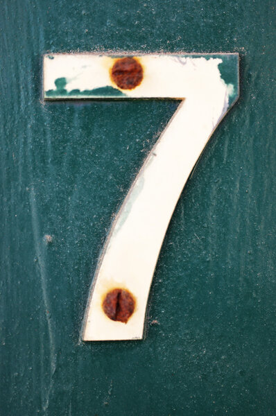 Number 7 attached with rusty nails