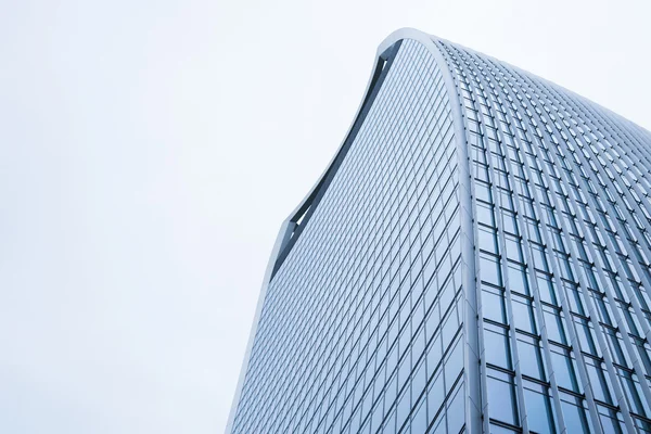 Perspective and underside angle view to textured background of contemporary glass building skyscrapers — Stock Photo, Image