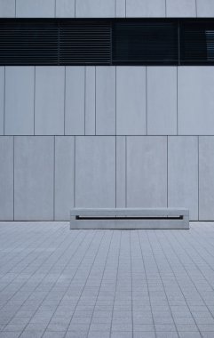 Empty Bench Against White Wall with Copy Space