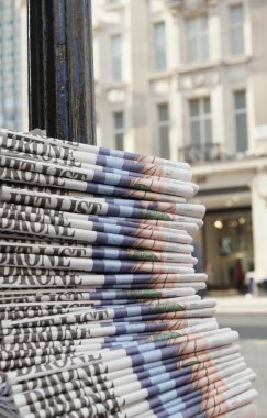 stack of the newspapers in the city clipart