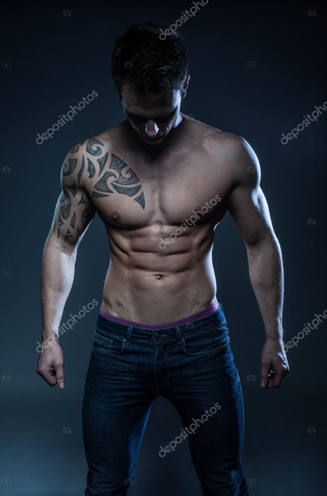 Male fitness model with the tattoo Stock Photo by ©nelka7812 94687648