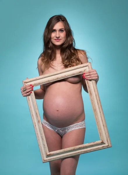 フォト フレームと pregnanat 女性 — ストック写真