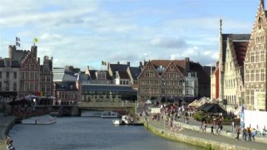 Gravensteen Castle and traditional buildings by the Grasbrug Bridge and Leie River in Ghent, Gent, Belgium.