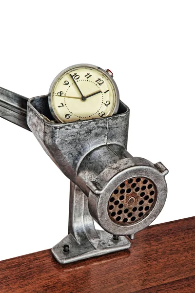 Alarm clock in manual meat grinder on white background. — Stock Photo, Image