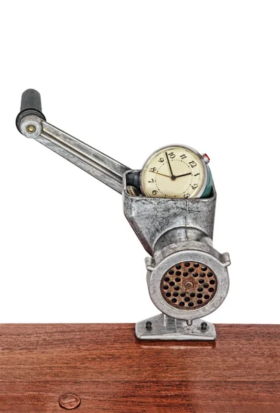 Alarm clock in meat grinder on white background. — Stock Photo, Image