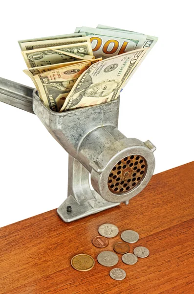 Dollar banknotes in meat grinder and coins on wooden table. — Stock Photo, Image