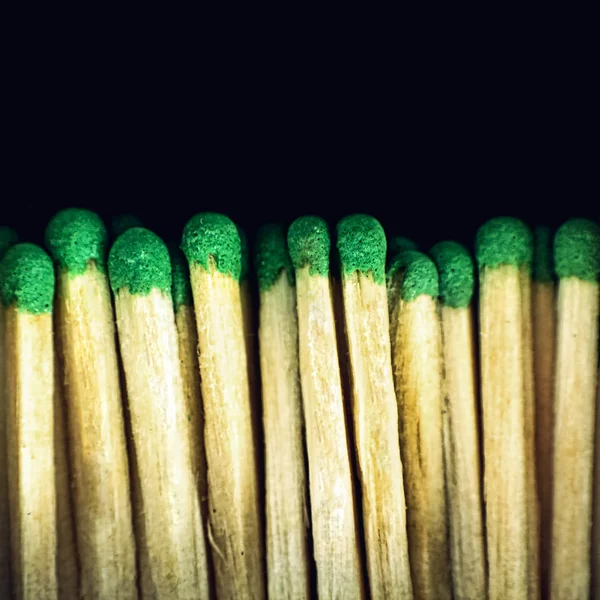 Group of wooden matches on black background. — Stock Photo, Image