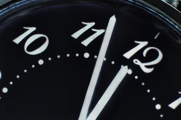 Clock face in darkness taken closeup.Eve of new year. — Stock Photo, Image