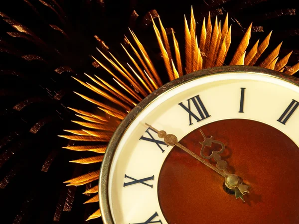 Dial of hours on a golden firework background.Eve of new year. — Stock Photo, Image