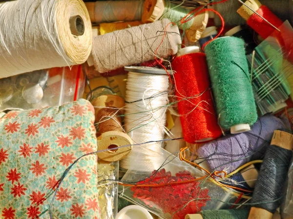 Multicolored threads spools for needlework taken closeup. — Stock Photo, Image