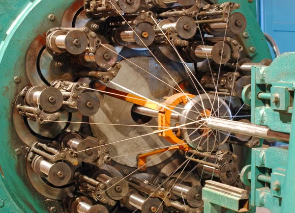 Braiding machine for weaving flexible metal hose. — Stock Photo, Image