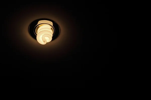 Energy save lamp on ceiling taken closeup. — Stock Photo, Image