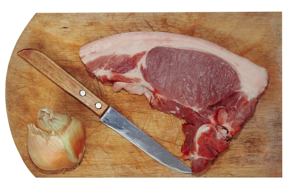 Raw pork meat, knife and onion on cutting board.Isolated.Top vie — Stock Photo, Image