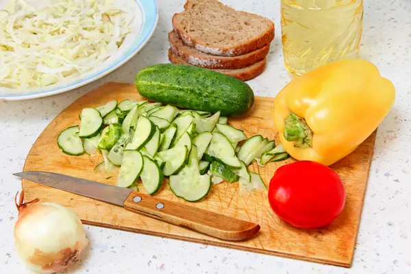 Appetizing salad ingredients on kitchen table. — Stock Photo, Image