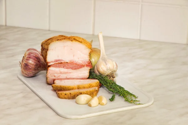 Sliced bacon on kitchen table. — Stock Photo, Image