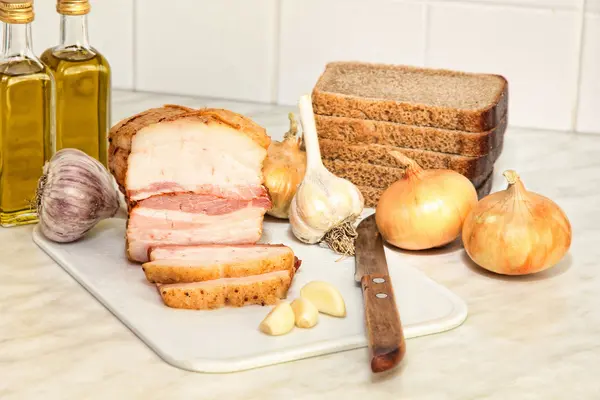 Sliced bacon and vegetables on kitchen. — Stock Photo, Image