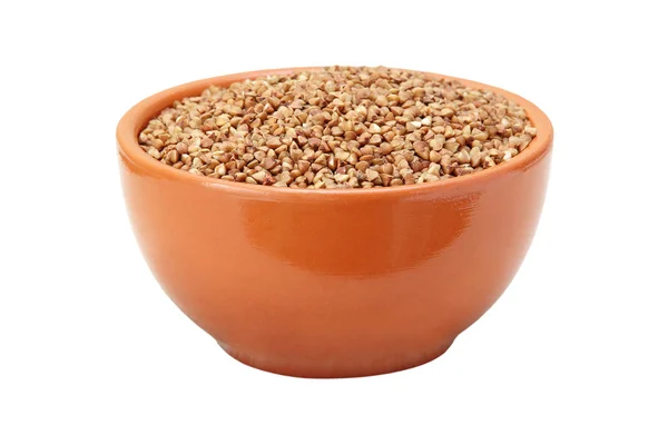 Buckwheat in brown ceramic bowl isolated on white. — Stock Photo, Image