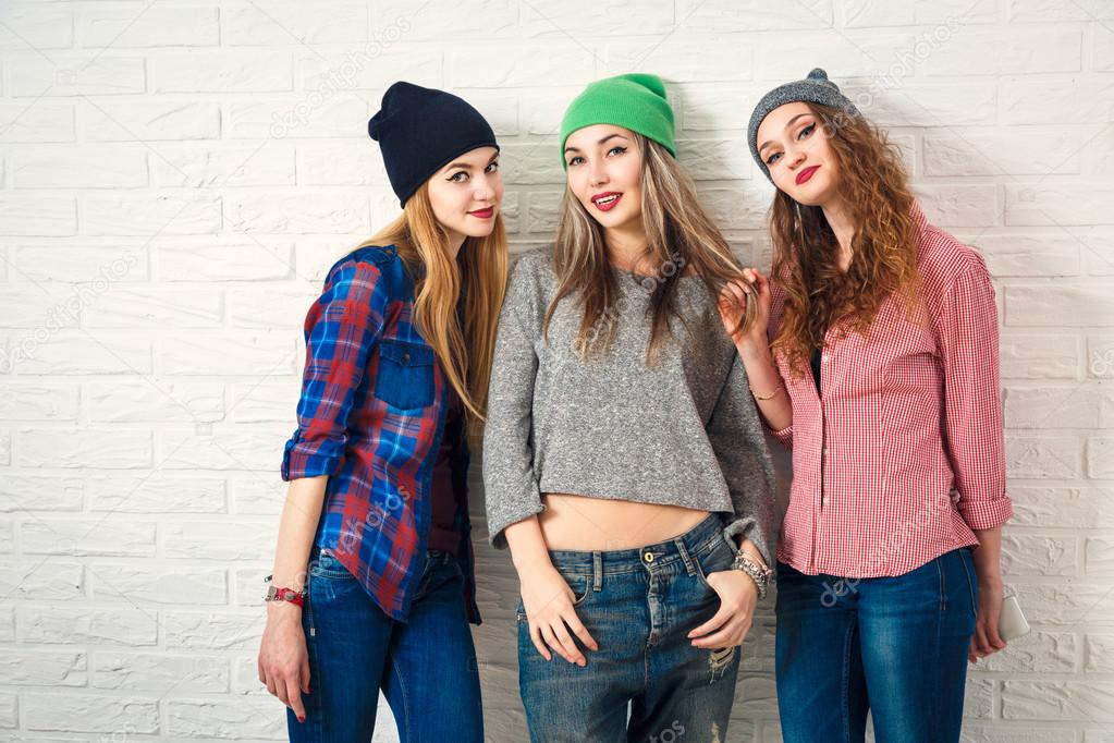 Three Funny Hipster Girls. Toned Photo.
