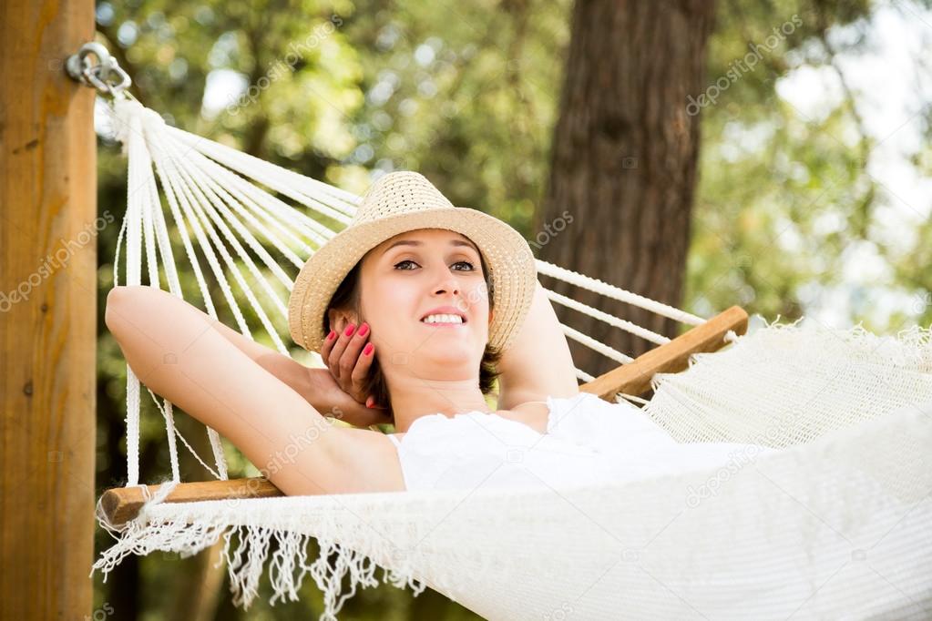 Young Woman Relaxing in a Hammock