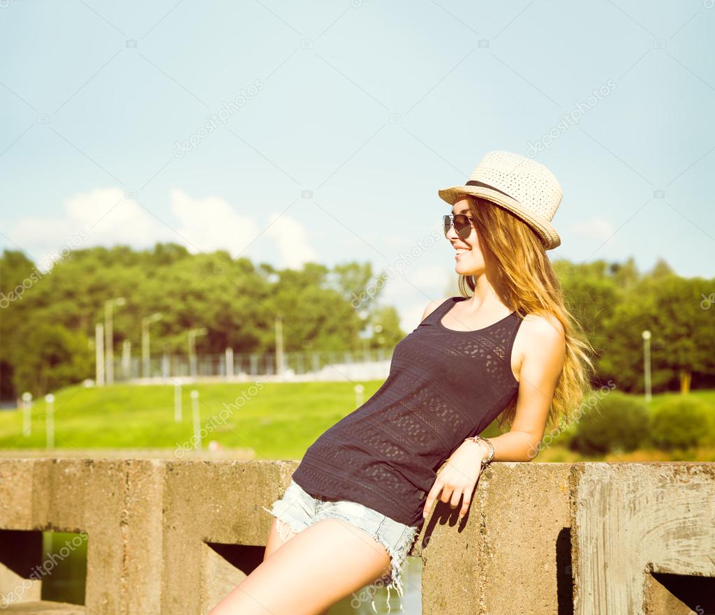 Trendy Hipster Girl Relaxing in the Park