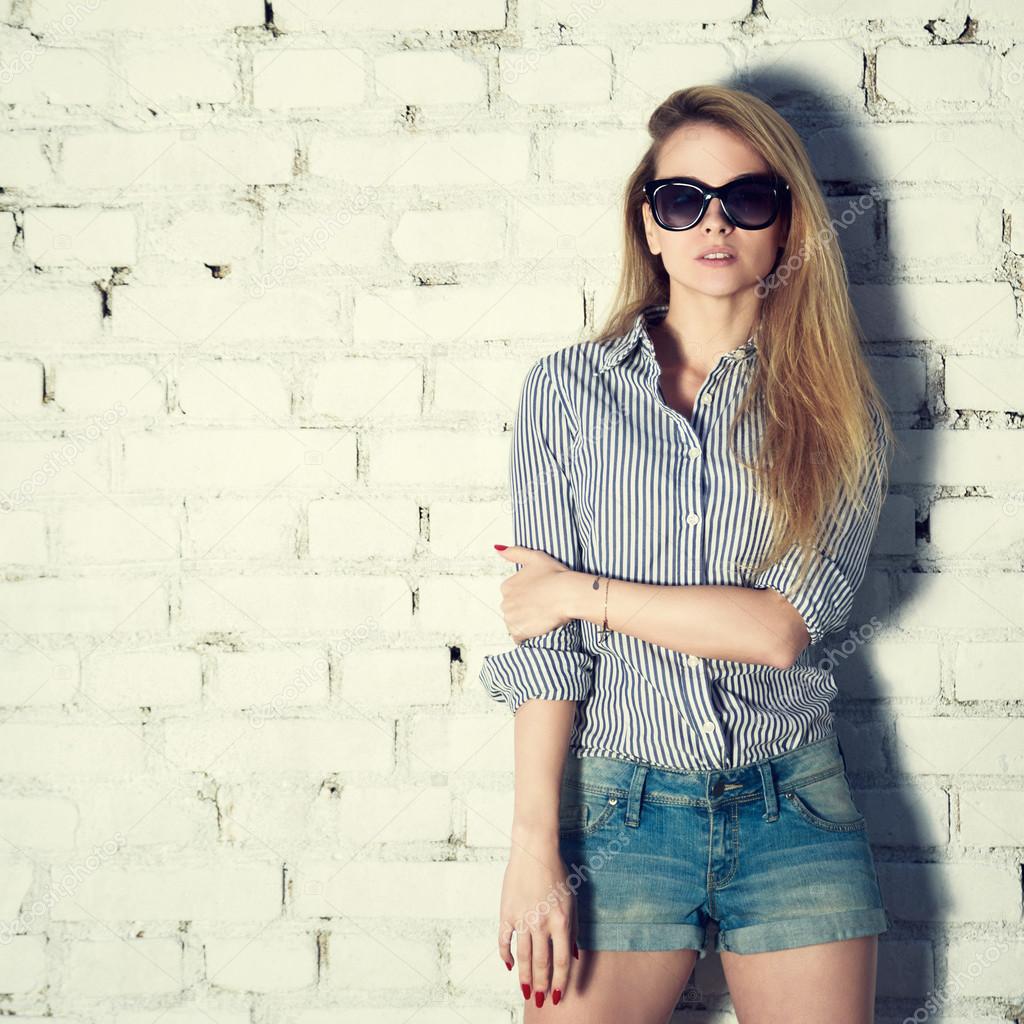 Fashion Photo of Hipster Woman at Brick Wall