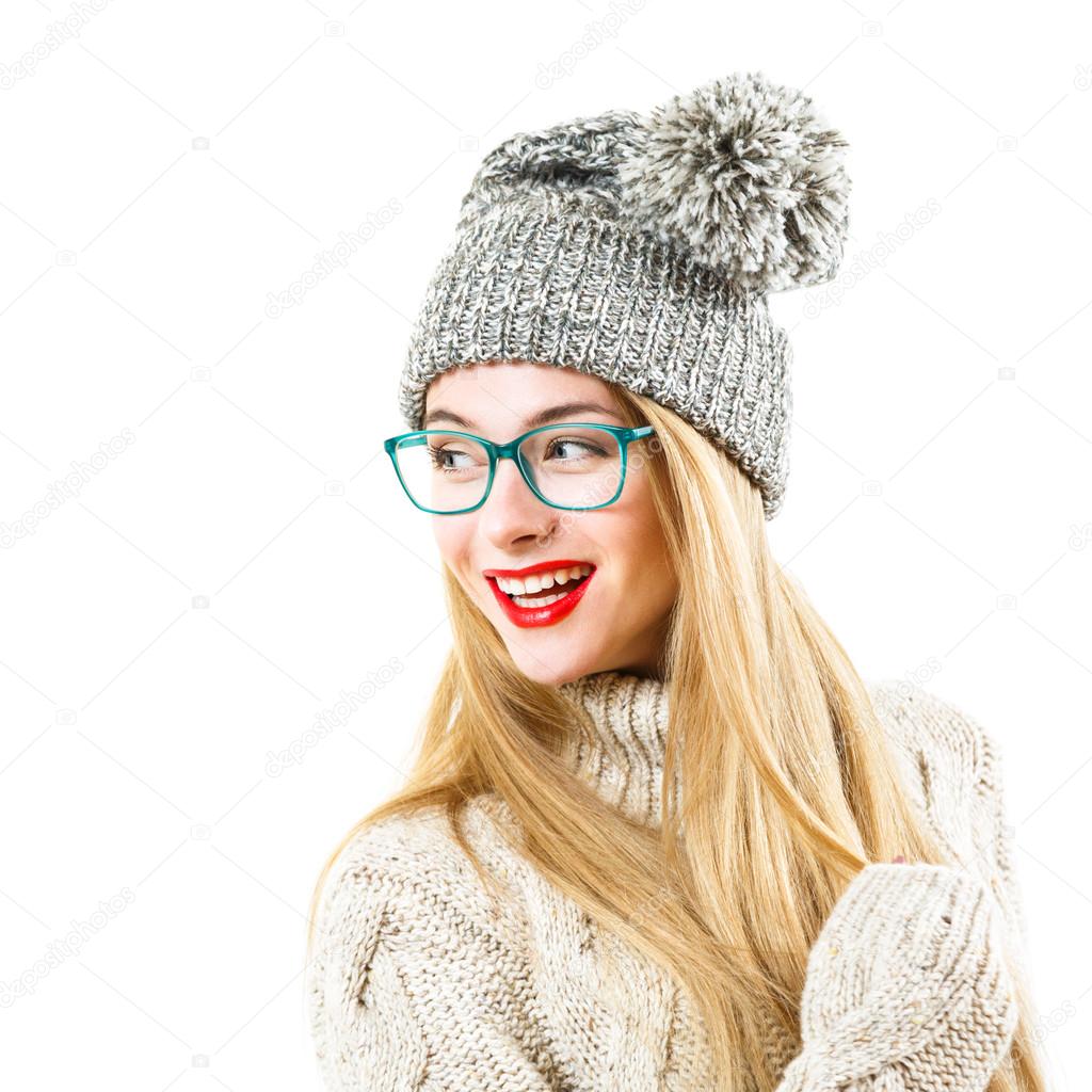 Smiling Hipster Girl in Winter Sweater and Hat on White