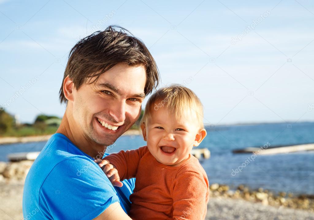 Happy Father with His Little Son at the Sea